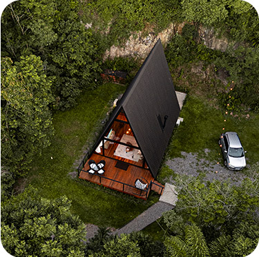 Vista externa da primeira cabana em meio à natureza